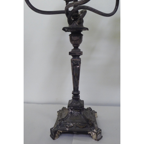 208 - A pair of early 20thC silver plated, five branch candelabra, each on a pedestal base  19