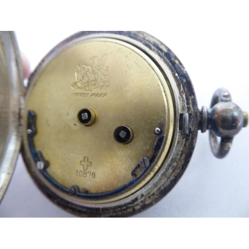 22 - Items of personal ornament: to include a gold plated half hunter pocket watch, faced by a Roman dial... 