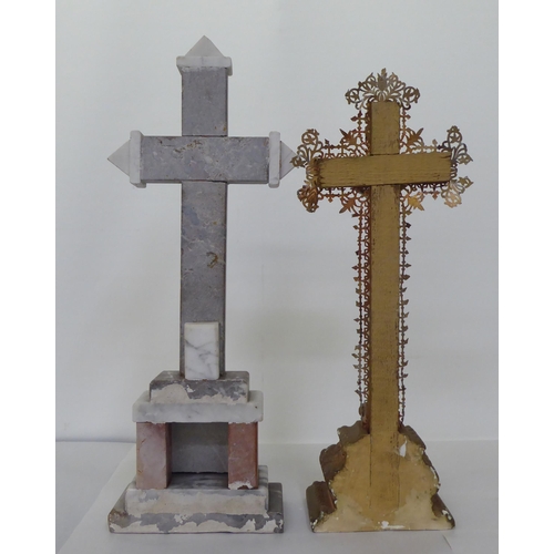 220 - Two freestanding crucifixes, one a cast metal example, decorated with floral patterns  16.5