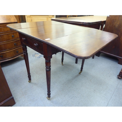 226 - A mid 19thC mahogany Pembroke table, the top with round corners, an end drawer and facsimile on the ... 