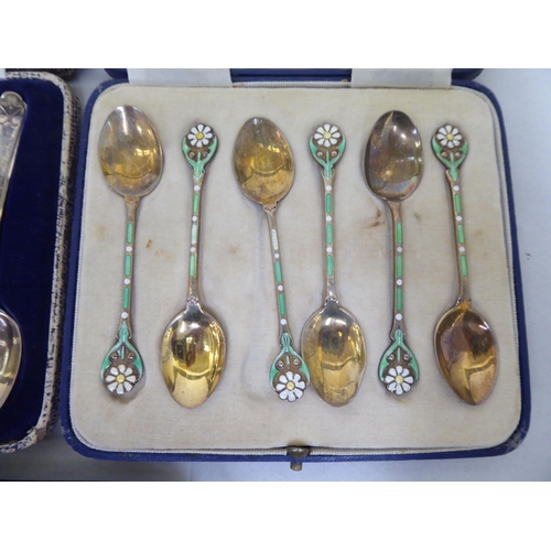 228 - Cased silver presentation spoons: to include a set of six gilded and coloured enamelled coffee spoon... 