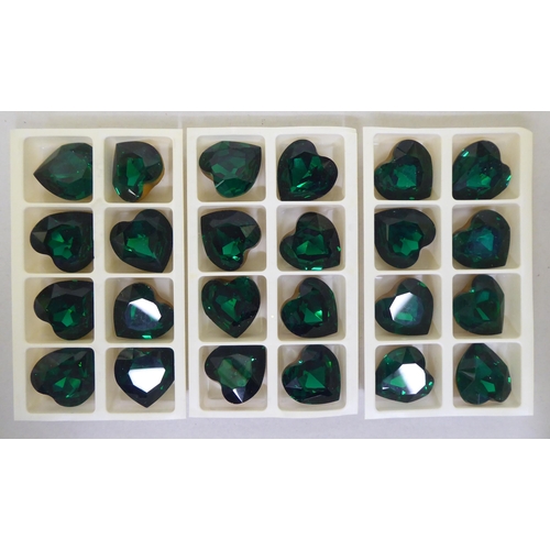 232 - A set of twenty-four Swarovski emerald coloured and gilded crystal heart shaped stones  boxed&n... 