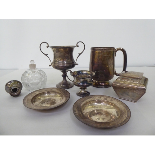 234 - Silver tableware: to include a one pint tankard; a twin handled pedestal trophy cup  5