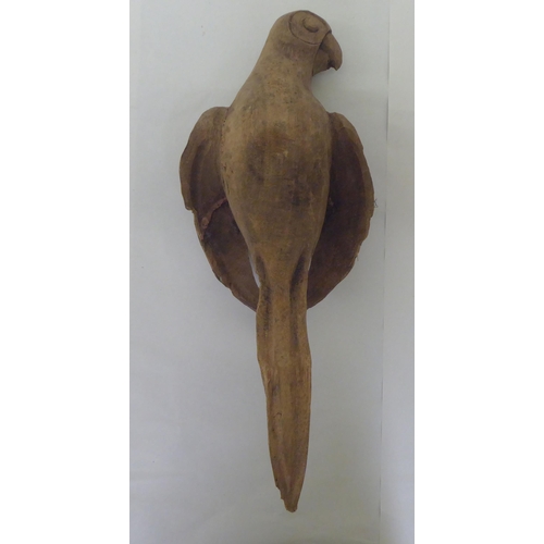 235 - A Continental carved oak model, a parrot  20