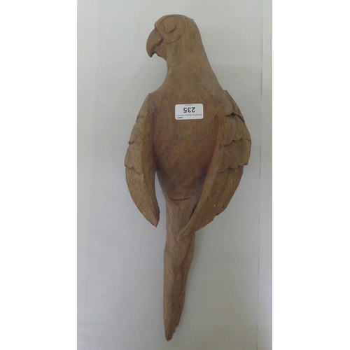 235 - A Continental carved oak model, a parrot  20