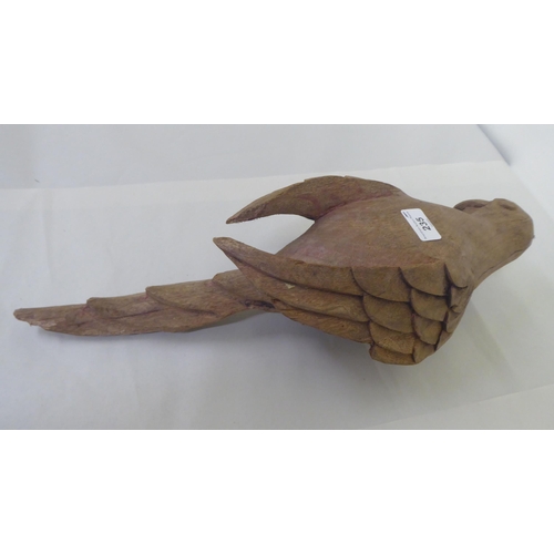 235 - A Continental carved oak model, a parrot  20