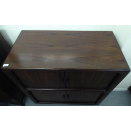 236 - A mid 20thC, possibly Dyrlund, rosewood finished media cabinet, comprising an arrangement of retract... 