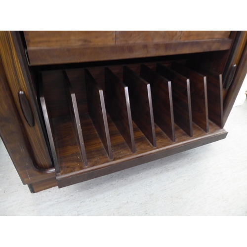 236 - A mid 20thC, possibly Dyrlund, rosewood finished media cabinet, comprising an arrangement of retract... 