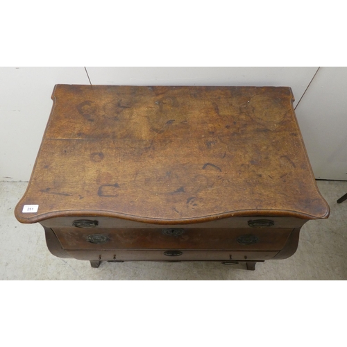 251 - A late 19thC Continental oak, four drawer, bombe front chest, raised on splayed forelegs  31