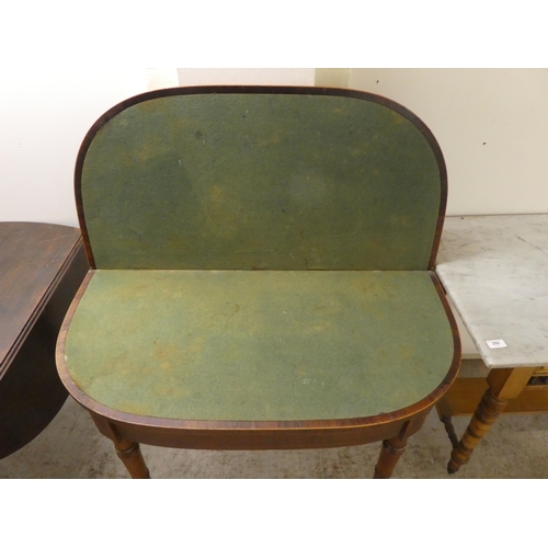 252 - An early 19thC rosewood demi-lune card table, the foldover top raised on ring turned, tapered legs, ... 