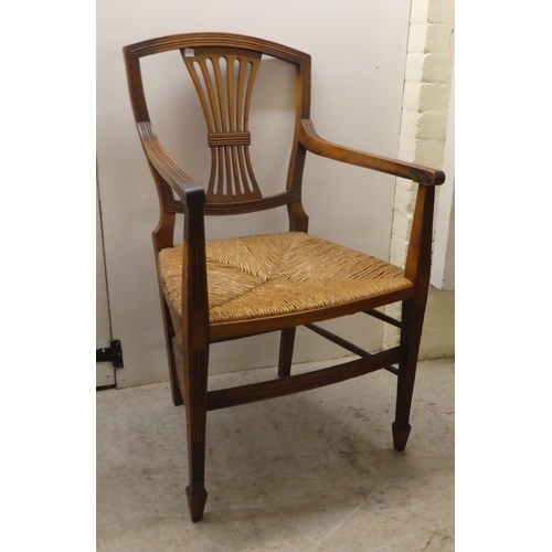 256 - Seven 19thC mahogany dining chairs: to include a pair with yoke rails and pierced splats, raised on ... 