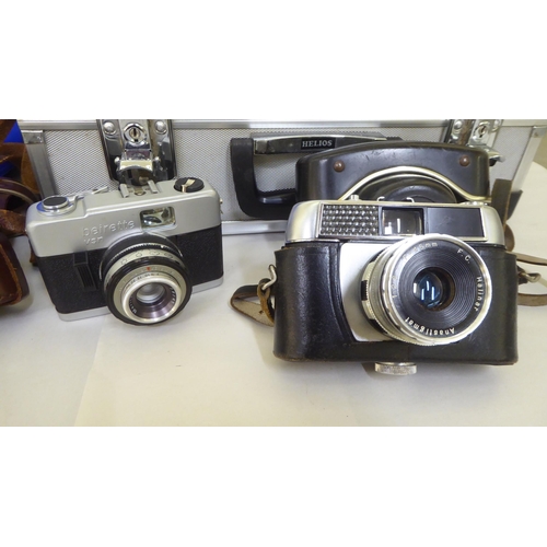 264 - Photographic equipment and accessories: to include a Zenith TTL camera, in a fitted hard case