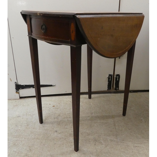 265 - A 19thC mahogany Pembroke table with an oval top, end drawer and facsimile on the reverse, raised on... 