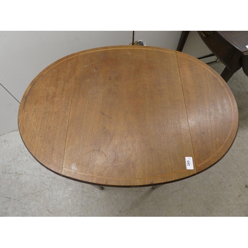 265 - A 19thC mahogany Pembroke table with an oval top, end drawer and facsimile on the reverse, raised on... 