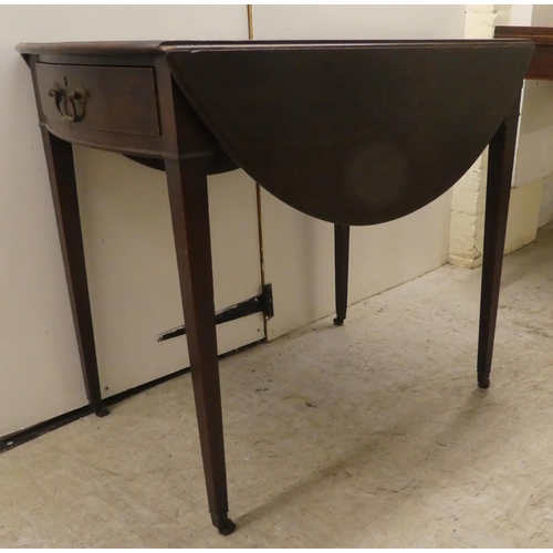 265 - A 19thC mahogany Pembroke table with an oval top, end drawer and facsimile on the reverse, raised on... 