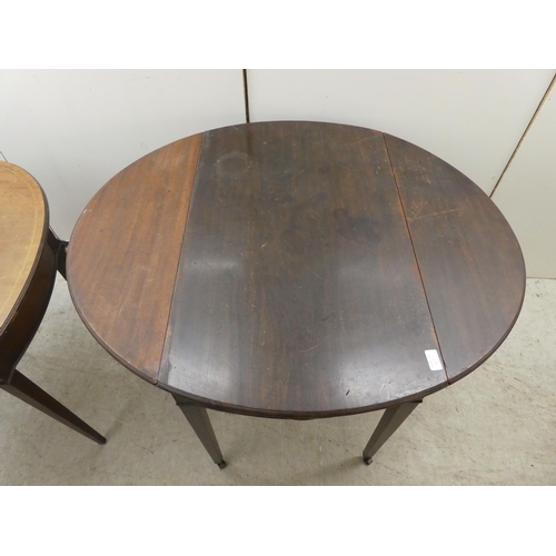 265 - A 19thC mahogany Pembroke table with an oval top, end drawer and facsimile on the reverse, raised on... 