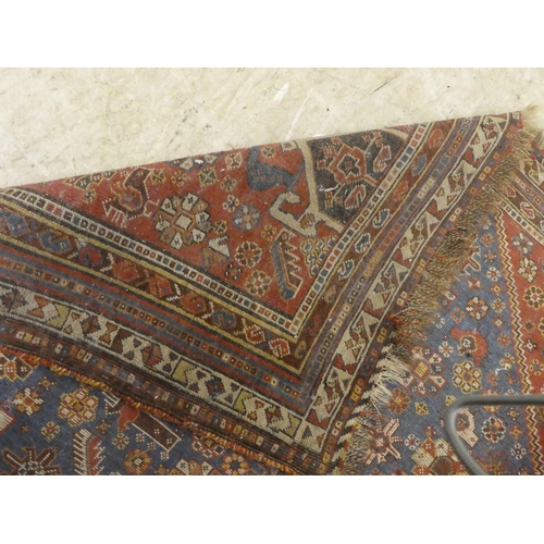 269 - A Persian rug, decorated in colours with floral and other designs  77