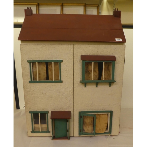 278 - A scratch built doll's house with a double opening front, containing various furniture  32