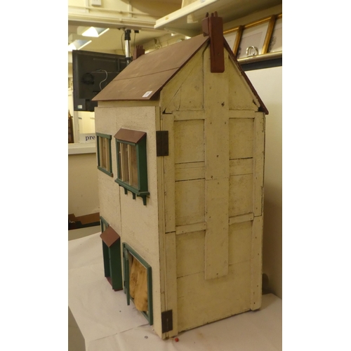 278 - A scratch built doll's house with a double opening front, containing various furniture  32