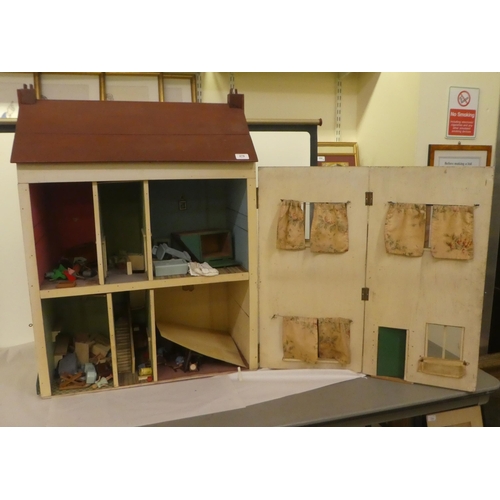 278 - A scratch built doll's house with a double opening front, containing various furniture  32