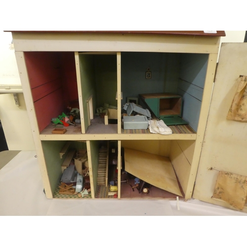 278 - A scratch built doll's house with a double opening front, containing various furniture  32