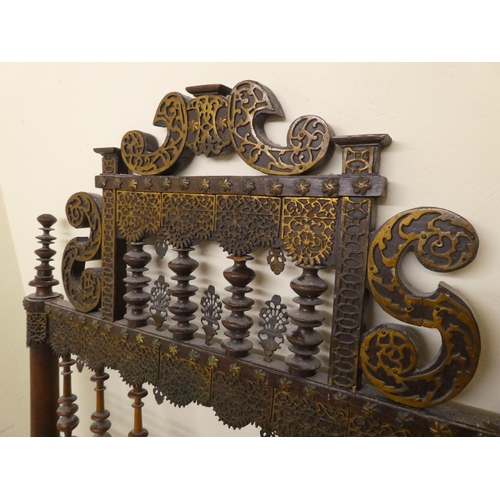 282 - A late 19thC Anglo-Indian carved hardwood and overlaid metal, single bedhead  41