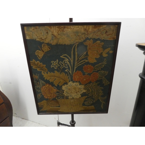 286 - A mid 19thC embroidered polescreen, the square panel on a mahogany column, raised on a tripod base&n... 