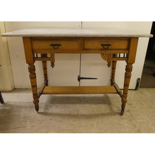 292 - An Edwardian satinwood washstand with a grey marble top, two drawers and a platform undershelf ... 