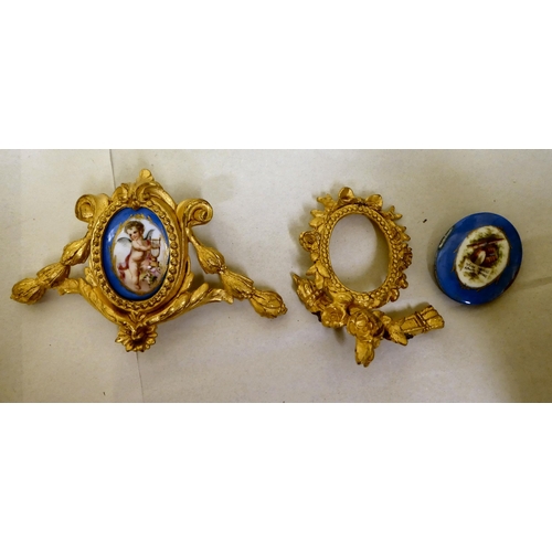 293 - Two late 19thC French gilt metal furniture/clock mounts, set with hand painted porcelain tiles 