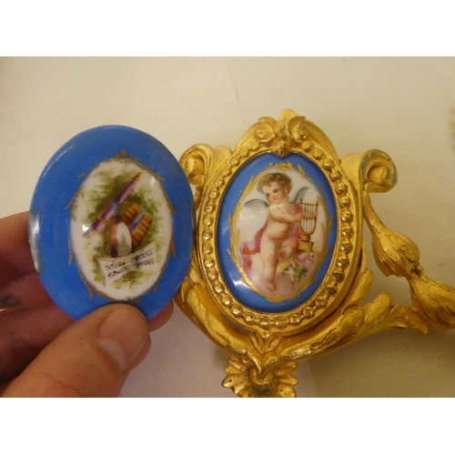 293 - Two late 19thC French gilt metal furniture/clock mounts, set with hand painted porcelain tiles 