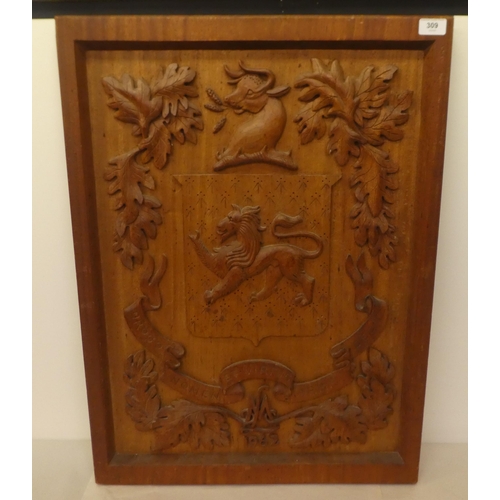 309 - A carved oak armorial panel  30