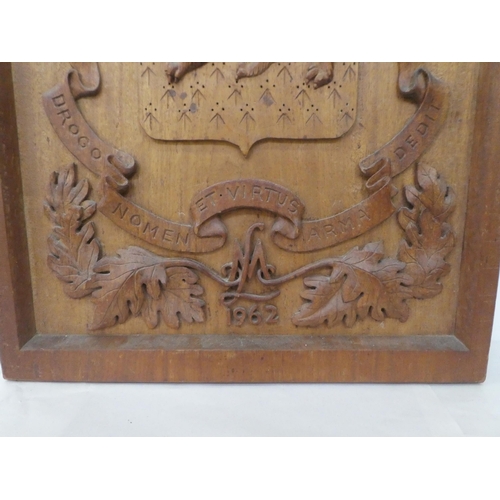 309 - A carved oak armorial panel  30