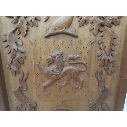 309 - A carved oak armorial panel  30