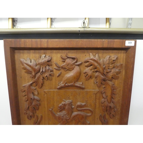 309 - A carved oak armorial panel  30