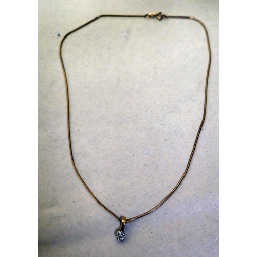 320 - A 9ct gold pendant, set with small diamonds, on a fine neckchain 