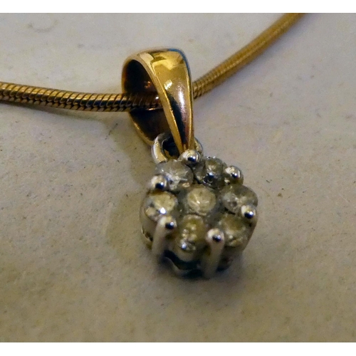 320 - A 9ct gold pendant, set with small diamonds, on a fine neckchain 