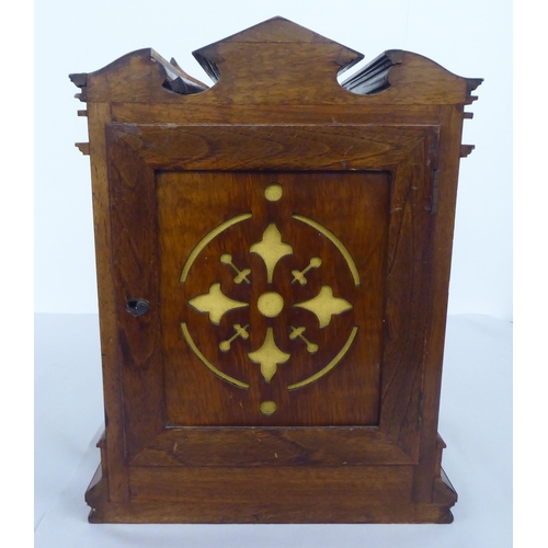 33 - An early 20thC burr walnut and mahogany cased mantel clock; the Roman dial inscribed J.Sewill of Lon... 