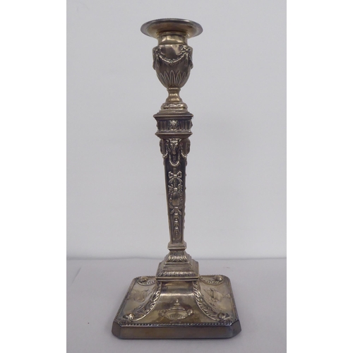 65 - An Edwardian loaded silver neo-classical, squared outlined candlestick with a detachable sconce  Wil... 