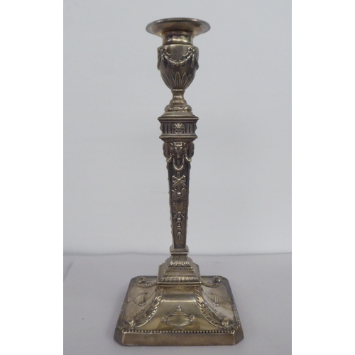 65 - An Edwardian loaded silver neo-classical, squared outlined candlestick with a detachable sconce  Wil... 