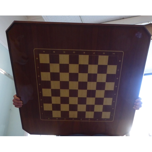 68 - An (unassembled) Italian inspired, parquetry crossbanded, fruitwoods combination games table, raised... 