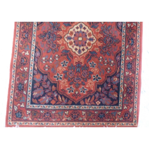 89 - Three small rugs: to include a Persian example, on a multi-coloured ground  47