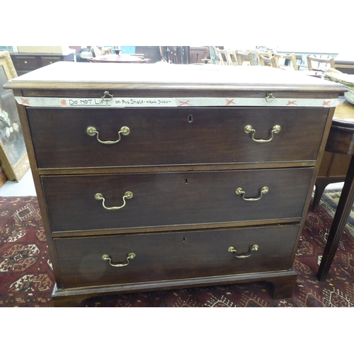 179 - An early 19thC mahogany chest with a brushing slide, over three lockable, deep drawers with brass ba... 