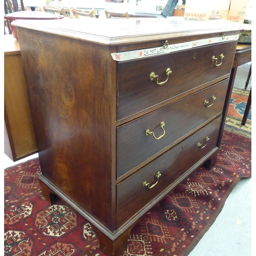 179 - An early 19thC mahogany chest with a brushing slide, over three lockable, deep drawers with brass ba... 