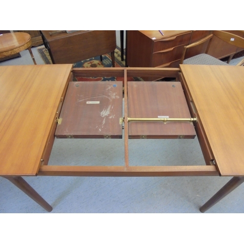 189 - A 1970s McIntosh teak draw leaf dining table, raised on round, tapered legs  29