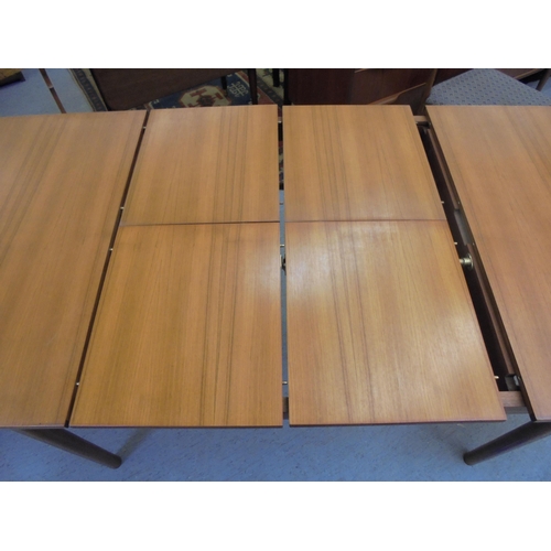 189 - A 1970s McIntosh teak draw leaf dining table, raised on round, tapered legs  29