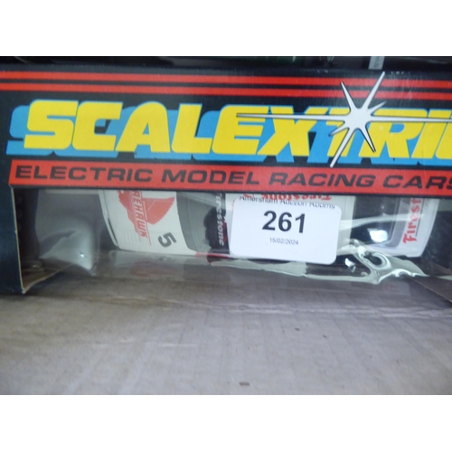 261 - A collection of Scalextric electric model vehicles: to include F1 and Rally examples  mianly bo... 