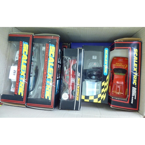 261 - A collection of Scalextric electric model vehicles: to include F1 and Rally examples  mianly bo... 