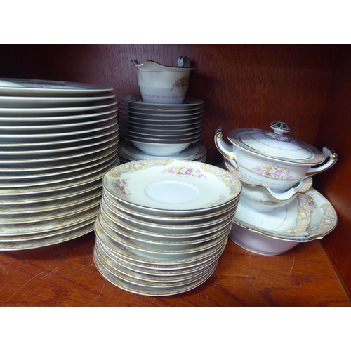 7 - A Noritake porcelain dinner service, decorated with bouquets