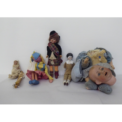 121 - Toys to include an early 20thC German bisque head doll with painted features, on a jointed compositi... 