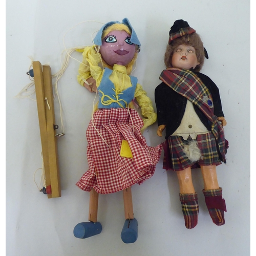 121 - Toys to include an early 20thC German bisque head doll with painted features, on a jointed compositi... 